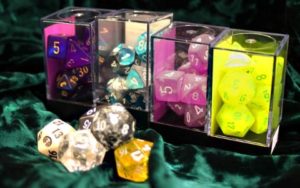 Various boxes of colored dice